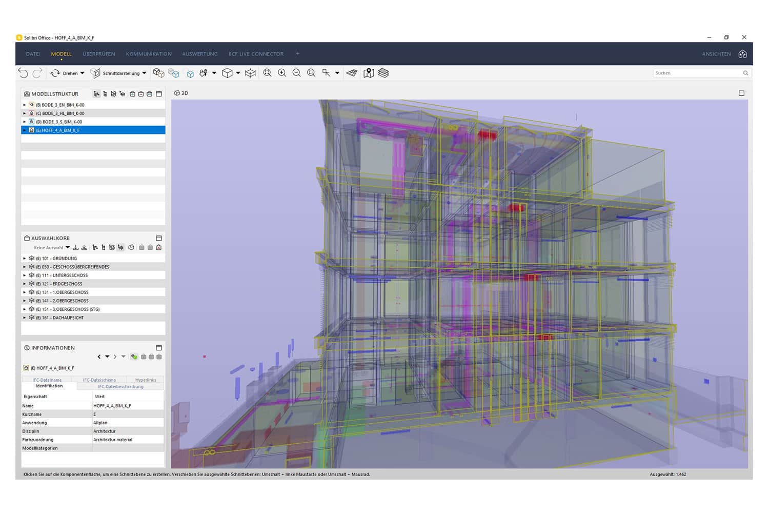 Auf einem Computerbildschirm wird das 3D-Architekturmodell eines mehrstöckigen Gebäudes mit farbigen Linien dargestellt, die die Gebäudesysteme innerhalb einer Softwareoberfläche darstellen. Menüs und Symbolleisten sind links und oben sichtbar.