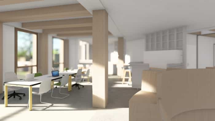 Ein moderner, offener Büroraum, der nach dem Prinzip des nachhaltigen Bauens gestaltet wurde, zeichnet sich durch große Fenster, weiße Schreibtische, ergonomische Stühle und Akzente aus Naturholz aus. Laptops und Büromaterial stehen auf den Schreibtischen, die von hellem Tageslicht durchflutet sind.